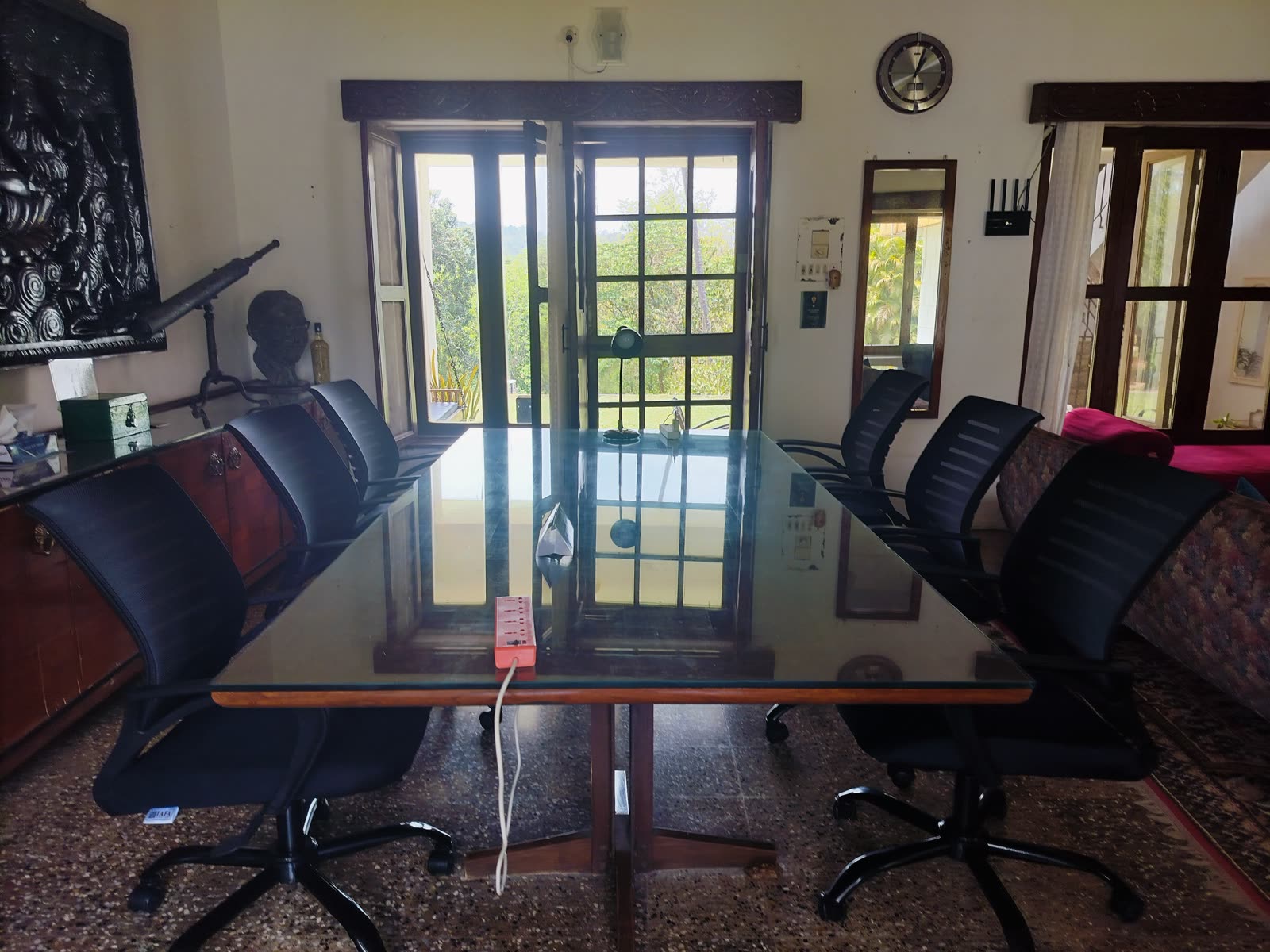 The team's coworking table, with the router on the wall behind it