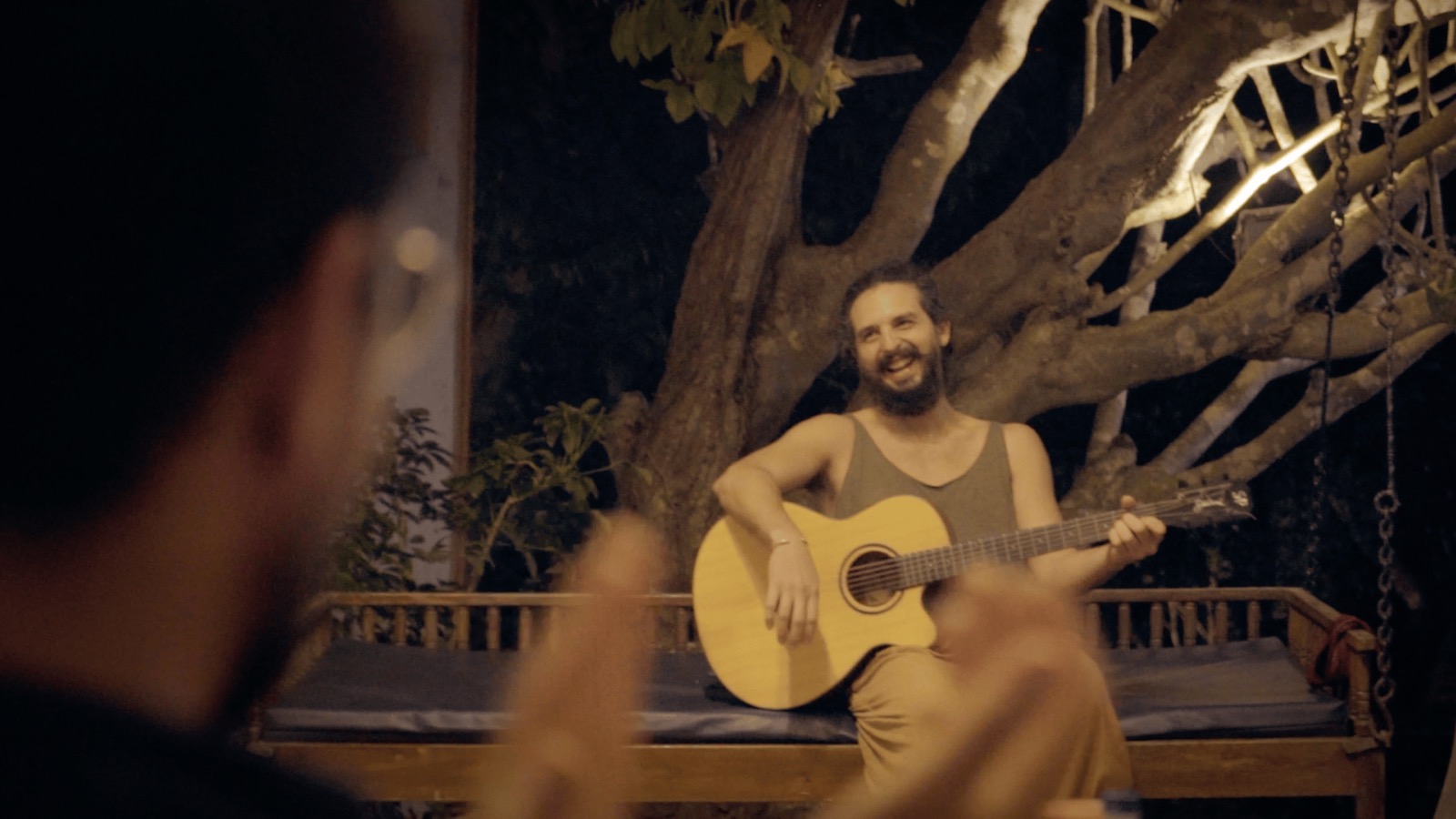 A swing bench, string lights, and a song that won't end