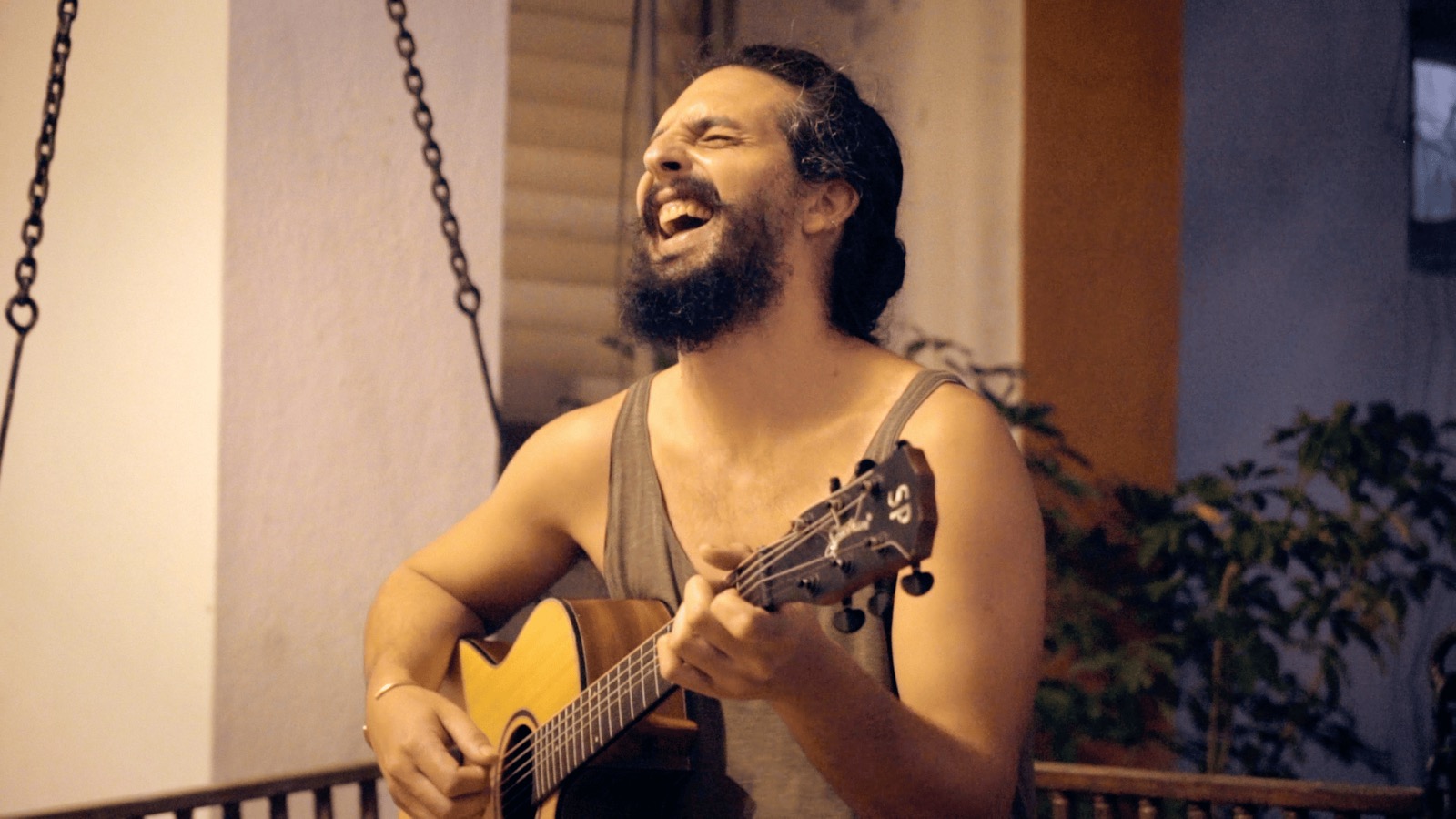 Santi finds a chord under the string lights